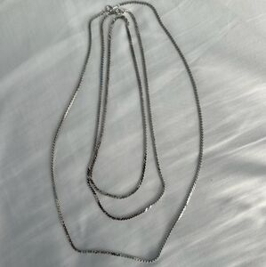 3 stacked silver chains